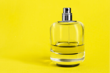 Perfume on yellow background