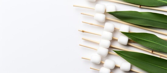 Eco friendly bamboo cotton buds for the hygiene of nose and ears showcased in a copy space image with white background