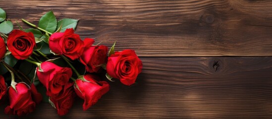 A romantic Valentine s Day setting with a copy space image displaying beautiful red roses arranged on a rustic wooden table