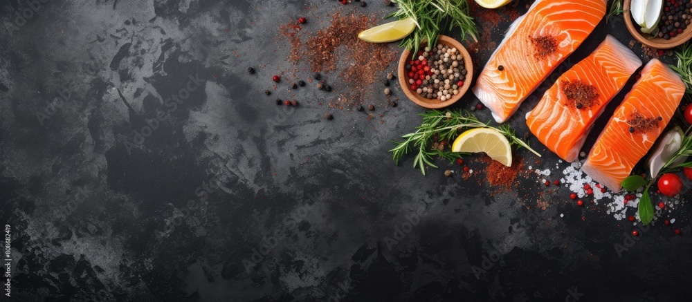 Poster a top view image of raw salmon fillet assorted salts and herbs placed on a grey concrete table backg
