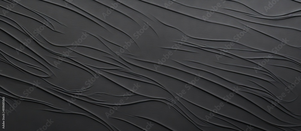 Poster a textured black paper with a sheet like appearance creates a background for copy space images