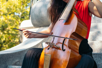 Woman musician playing cello