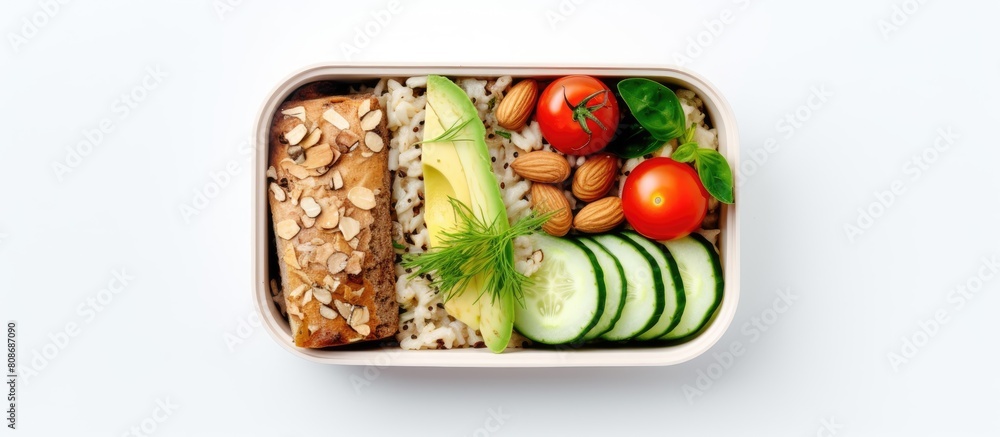 Poster top down view of a lunch box dinner filled with a nutritious assortment of oatmeal cucumber salad nu