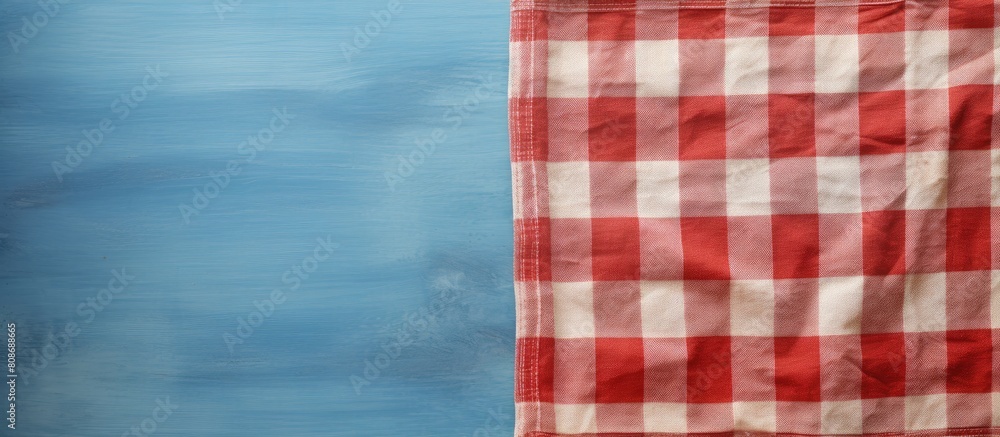 Aufkleber top view copy space image of a vintage checkered towel with a textured background
