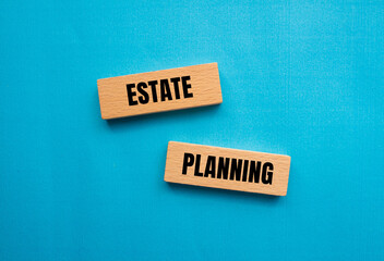 Estate planning words written on wooden blocks with blue background. Conceptual estate planning...