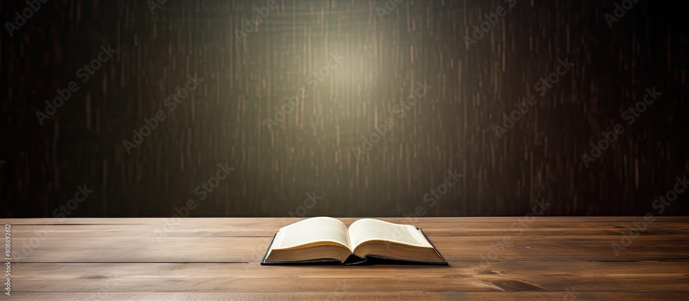 Poster the table displays an open book with ample copy space image