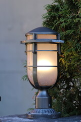 Lamp with a glowing light illuminating the street