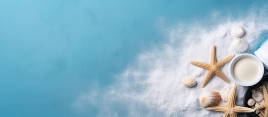 Plakat Top view copy space image of sea salt spa and aroma spa cosmetics accompanied by a towel and shells all set against a serene blue background