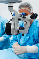 Skilled surgeon and his medical team performs precise eye surgery on an elderly patient, restoring vision with latest medical technology and cutting-edge techniques. Modern eye surgery concept.