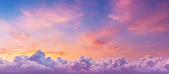 Fototapeta premium A stunning color combination of magenta and yellow fills the sky during the golden hour creating a captivating skyscape for sky replacement in landscape orientation Copy space image