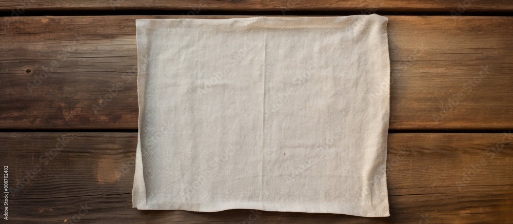 Poster copy space image of a napkin placed on a vacant weathered wooden surface with a view from above