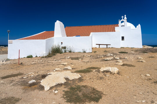 Typical white Chapel of Santo Estevao do Baleal in the Baleal island, Peniche, Portugal, in a sunny day.
