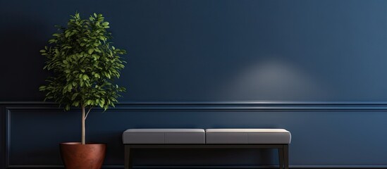 Image of a Navy blue velvet bench positioned alongside a table adorned with a potted plant sitting underneath a warm lamp within the interior of an anteroom. Copy space image