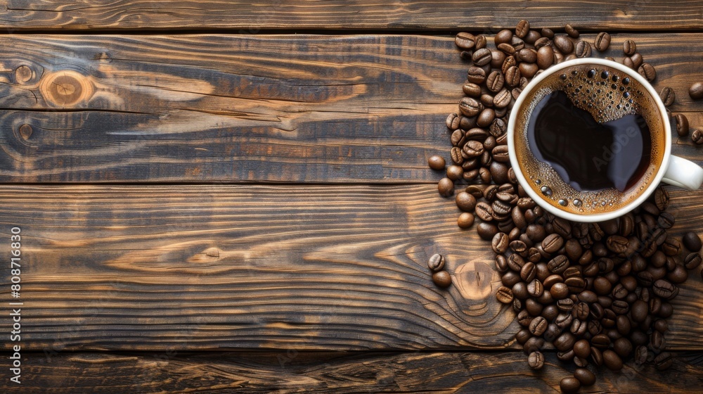 Poster coffee cup and beans on old wood background selective focus. Top view with copy space for your text