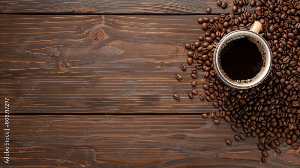 Poster Coffee cup and beans on wood background selective focus.Top view with copyspace for your text