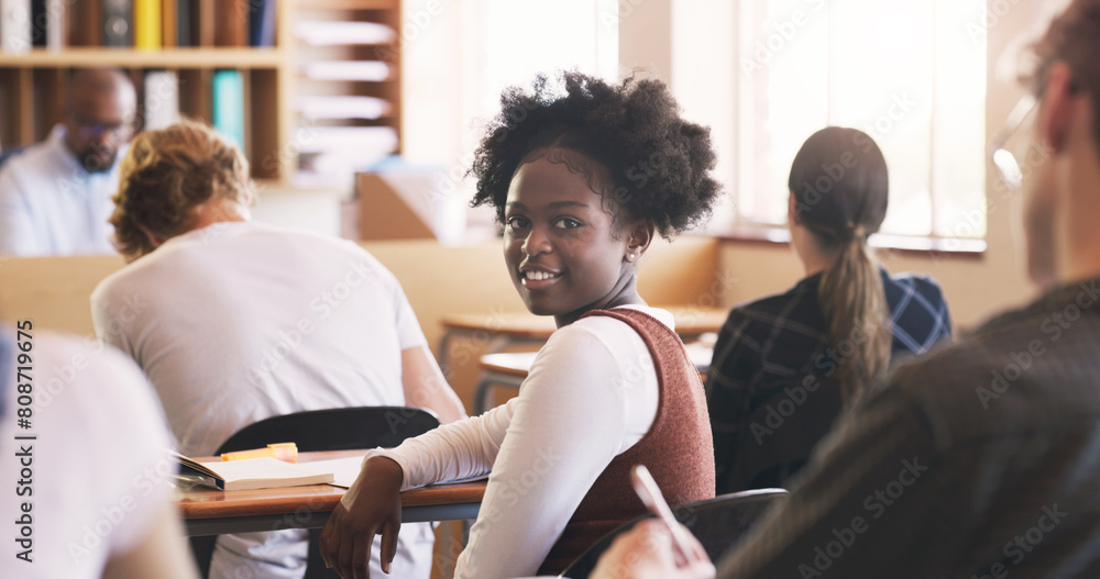 Wall mural Teenager, girl and portrait in classroom for education lecture in high school or scholarship, notebook or students. Female person, face and desk for academic development or academy, smile or study