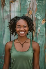 Fototapeta premium Smiling Woman in Green Tank Top
