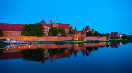 Marienburg castle the largest medieval brick castle in the world in the city of Malbork evening...