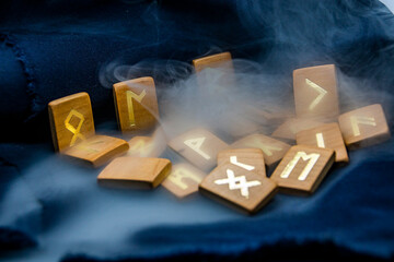 Gray thick smoke spreads on wooden runes	
