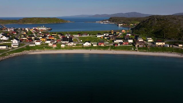 Aerial view away from the Pykeija village, midnight sun in Finmark, Norway