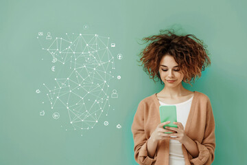 Curly-haired woman looking at smartphone with graphic network icons on a mint green background