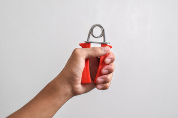 Finger-Hand exerciser has handgrip for exercise isolated on white background