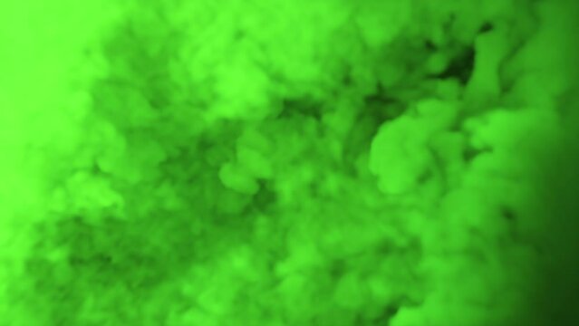 the bubbling of thick green smoke