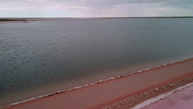 Lake Macdonnell And Point Sinclair Pink Lake - Salt Lake In Penong, South Australia. - aerial pullback shot