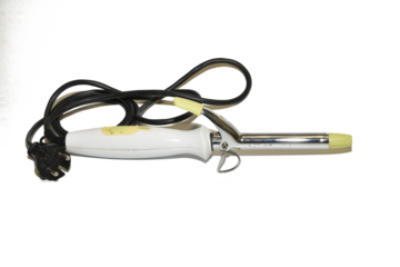 On a white background lie curling irons with which women curl their hair on their heads.