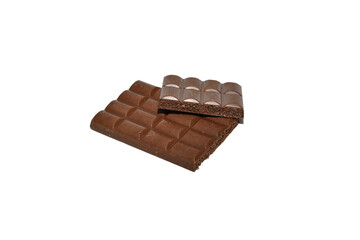 A broken chocolate bar filled with nuts lies on a white background.