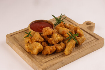Crispy Chicken Popcorn with Tomato Sauce.