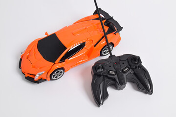 Remote controlled toy car with a game controller. RC cars can turn into robots