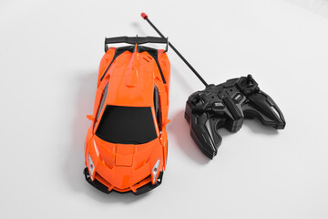 Remote controlled toy car with a game controller. RC cars can turn into robots