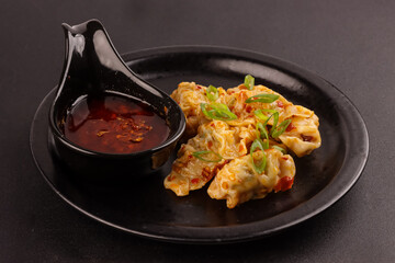 Pangsit Chili Oil is Dimsum or Wonton With Garlic Chili Oil. 