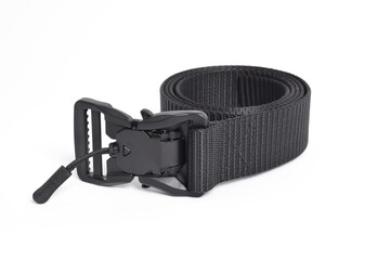 Black mens nylon fastening belt isolated on white background. Men's outdoor military tactical belt.