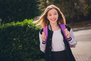 Photo of sweet pretty girl wear school uniform rucksack walking college outside urban city park