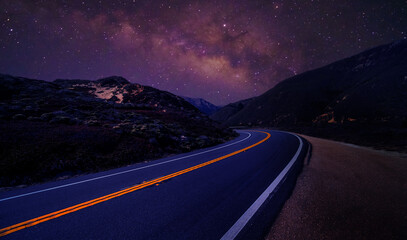 Road with milky way background.