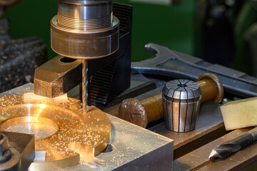The drilling process on NC milling machine with brass material.