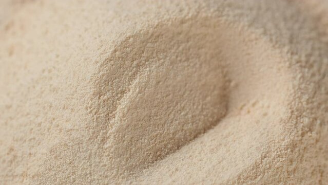 Taking spoon with collagen powder. Collagen powder dietary supplement