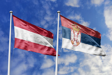 3d illustration. Austria and Serbia Flag waving in sky. High detailed waving flag. 3D render. Waving in sky. Flags fluttered in the cloudy sky.