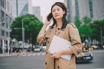 Young Professional Woman on a Call in the City