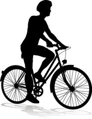 Obraz premium Bicyclist riding their bike and wearing a safety helmet in silhouette
