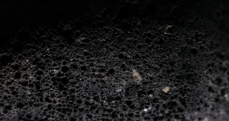 Porous Stone Texture Resembling a Lunar Landscape. Close-up, shallow dof.