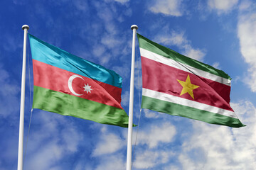 3d illustration. Azerbaijan and Suriname Flag waving in sky. High detailed waving flag. 3D render. Waving in sky. Flags fluttered in the cloudy sky.