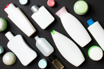 Group of plastic bodycare bottle Flat lay composition with cosmetic products on colored background empty space for you design. Set of White Cosmetic containers, top view with copy space