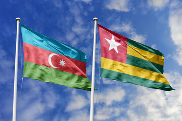3d illustration. Azerbaijan and Togo Flag waving in sky. High detailed waving flag. 3D render. Waving in sky. Flags fluttered in the cloudy sky.