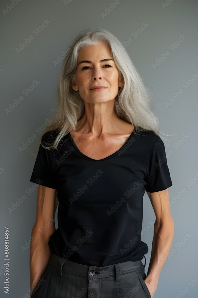 Wall mural Elegant Elderly Woman with Long White Hair in Black T-Shirt