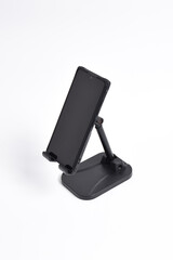 Phone holder stand that can be adjusted to height angle isolated on white background. holder for phone, phone stand, mount, universal