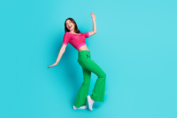 Full body photo of excited active girl dance discotheque have fun empty space advert isolated blue color background