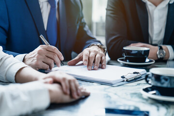 Successful businessman in suit signing contract concept. Agreement was signed co-investment...